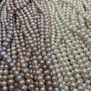 Macro shot of natural freshwater pearl strands in white, pink, and purple colors