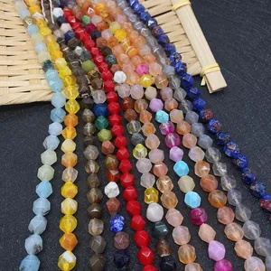 Macro detail of faceted natural gemstone beads in various vibrant colors for DIY jewelry