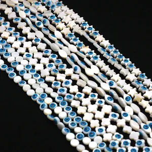 Perles en nacre naturelle avec œil bleu maléfique en formes d'étoile et fleur