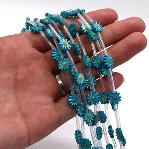 Close-up of turquoise shell daisy beads for DIY necklace and jewelry making
