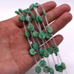 Close-up of green freshwater shell daisy beads for DIY necklace jewelry making