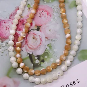 Natural round shell beads in white and golden brown for DIY jewelry making