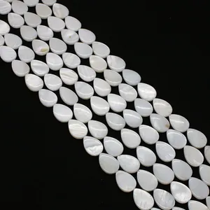 Macro view of teardrop natural mother of pearl beads with iridescent luster for jewelry DIY