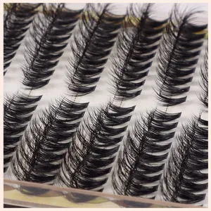 Detailed macro view of dense black individual eyelash extensions in organized rows