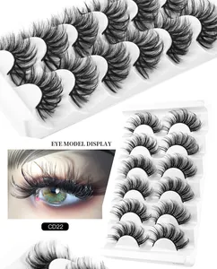 Detail of 8D faux mink eyelashes set with thick curled crisscross design on a white tray