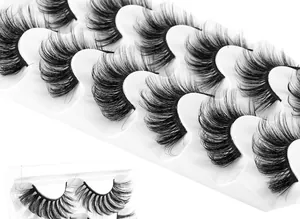 Macro detail of 6 pairs of thick, curly faux mink lashes with a crisscross pattern