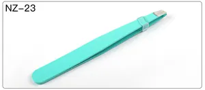 Detail of mint green slanted stainless steel eyebrow tweezers with a matte finish