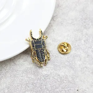 Exquisite beetle enamel brooch with gold finish and black beetle insect design