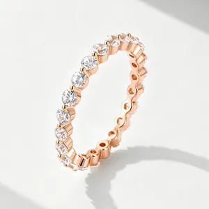 Elegant 18k rose gold plated eternity ring featuring a full circle of round cubic zirconia