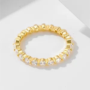 Macro shot of gold-plated eternity ring featuring 2.5mm round-cut cubic zirconia stones