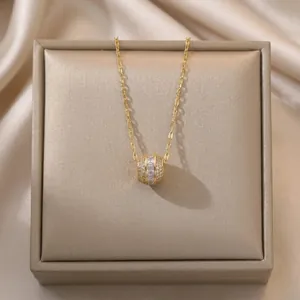 Titanium steel cylinder pendant necklace with sparkling cubic zirconia on gold O-chain