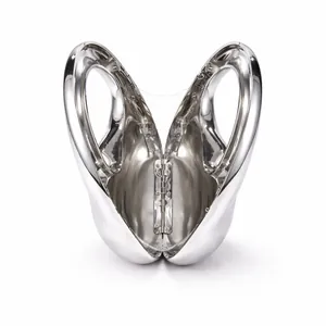 Detailed view of the open hinge mechanism on a silver mirror-finish oval evening bag