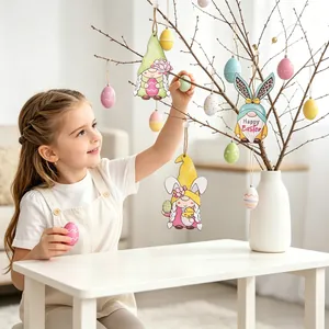 Close-up of wooden Easter gnomes and colorful eggs hanging on indoor decorative branches