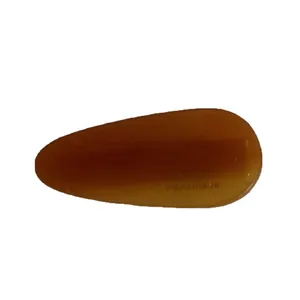 Amber teardrop acetate hair clip with France Handmade lettering on a white background