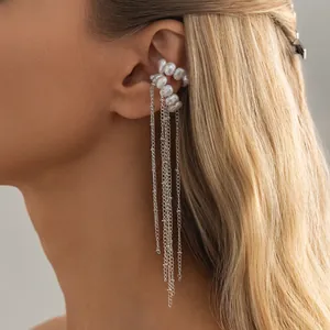 Elegant silver tassel ear cuff jewelry featuring white pearls and long hanging chains.
