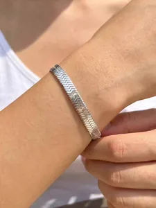 Detail of silver snake bone chain bracelet showing 6mm flat metal weave texture