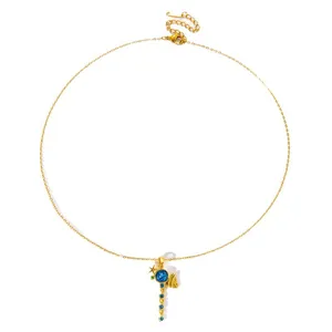 Elegant gold clavicle necklace featuring a blue zircon pendant with star and wing details.