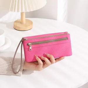 Rose pink long clutch wallet with lychee pattern texture and dual zipper compartments