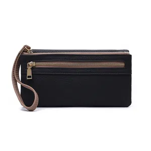 Detail of black pebbled faux leather wallet with gold zippers and khaki wrist strap