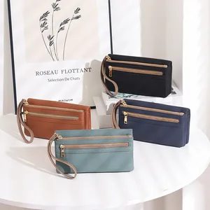 Close-up of multi-color long wallets with litchi texture and double zipper wristbands