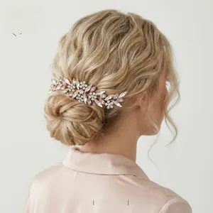 Detail of pink marquise rhinestone hair comb styled on a low bun hairstyle