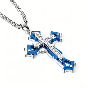 Detail of triple-layer titanium steel cross pendant with blue accents and cubic zirconia