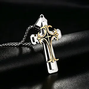 Macro detail of triple-layered cross pendant with golden patterns on box chain