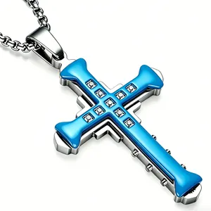 Detailed macro of stainless steel cross pendant with blue enamel and sparkling zircons