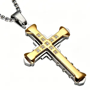 Close-up of dual-layer stainless steel cross pendant with gold finish and zircon inlay