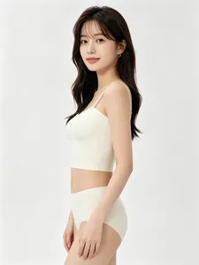 Detail view of seamless white lingerie set with thin straps on model from side angle