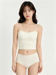 Detail of seamless cream lingerie set with thin straps and matching high waist panties