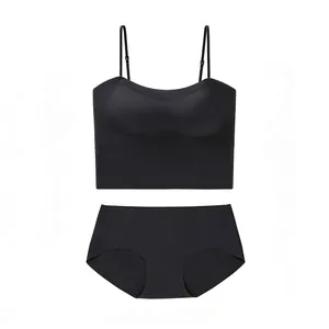 Detail of black seamless lingerie set with thin straps camisole and matching briefs