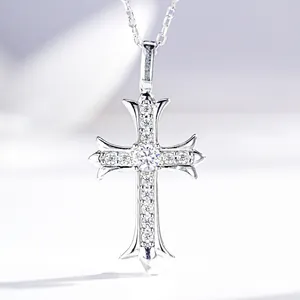 Detailed macro shot of a gothic silver cross pendant with sparkling zircon inlays