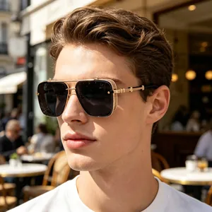 Close-up of vintage punk square sunglasses worn by a male model in an outdoor cafe