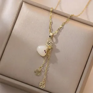 18K gold plated necklace with heart jade pendant and lucky coin tassels in jewelry box