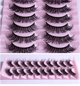 Detailansicht von 10 Paar natürlichen dicken lockigen schwarzen Wimpern in rosa Schale