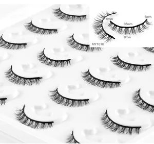 Detailed view of 35mm wide black false eyelashes with 6-8mm lengths on white tray