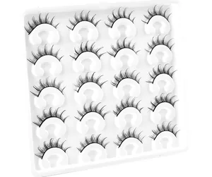Macro view of 20 pairs of wispy faux mink eyelashes neatly arranged on a white tray