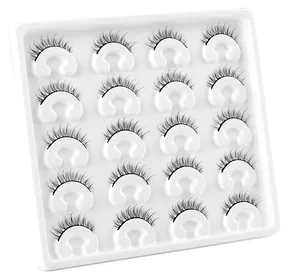 Detailed view of 20 pairs of dense faux mink eyelashes in a white collection tray