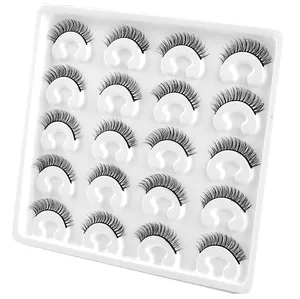 Detailed view of 20 pairs of dense faux mink eyelashes arranged in a white plastic tray