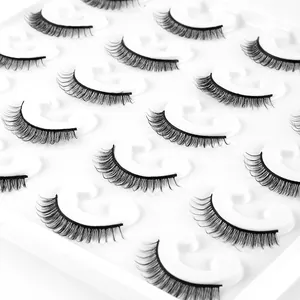 10 pairs of dense curly faux mink eyelashes in natural black on a clean white tray