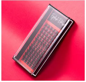 Detailed top view of individual cluster eyelash extensions in a red premium packaging