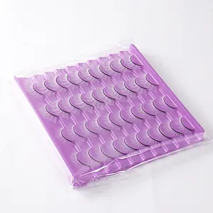 Macro detail of 20 pairs of dense black eyelashes neatly arranged on a purple tray