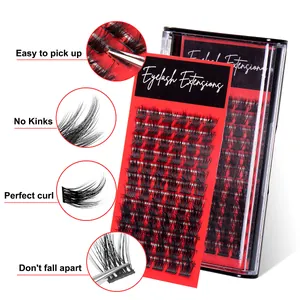 Individual eyelash extensions set with natural curl on a red backing board