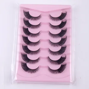 Macro detail of 7 pairs of fox-eye false eyelashes with volume and wispy tapered ends