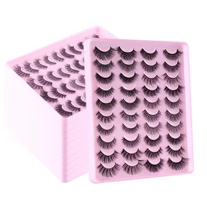 Lot de 20 paires de faux cils denses et volumineux sur plateaux roses sur fond blanc