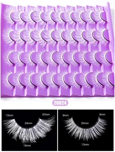 Macro detail of white faux eyelashes on purple tray with fiber density and size markings