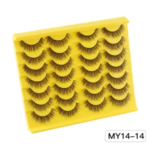 Close-up of 14 pairs of thick faux mink eyelashes neatly arranged on a yellow tray