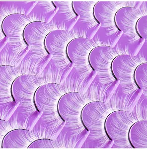 Macro shot of white long fiber false eyelashes with black roots on purple tray