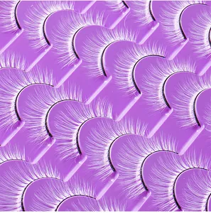 Macro shot of 20 pairs of white synthetic false eyelashes in a purple tray